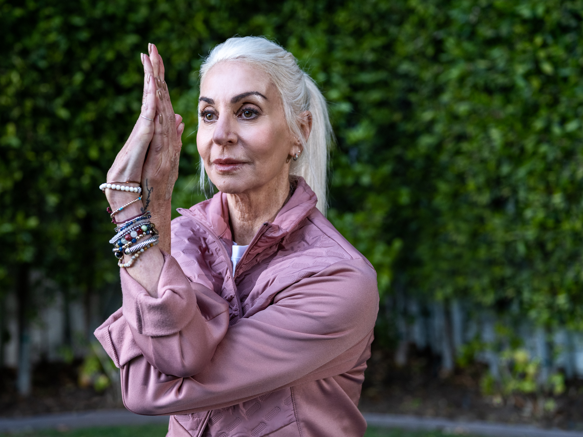 An older woman practices yoga for an advertising campaign in Los Angeles.