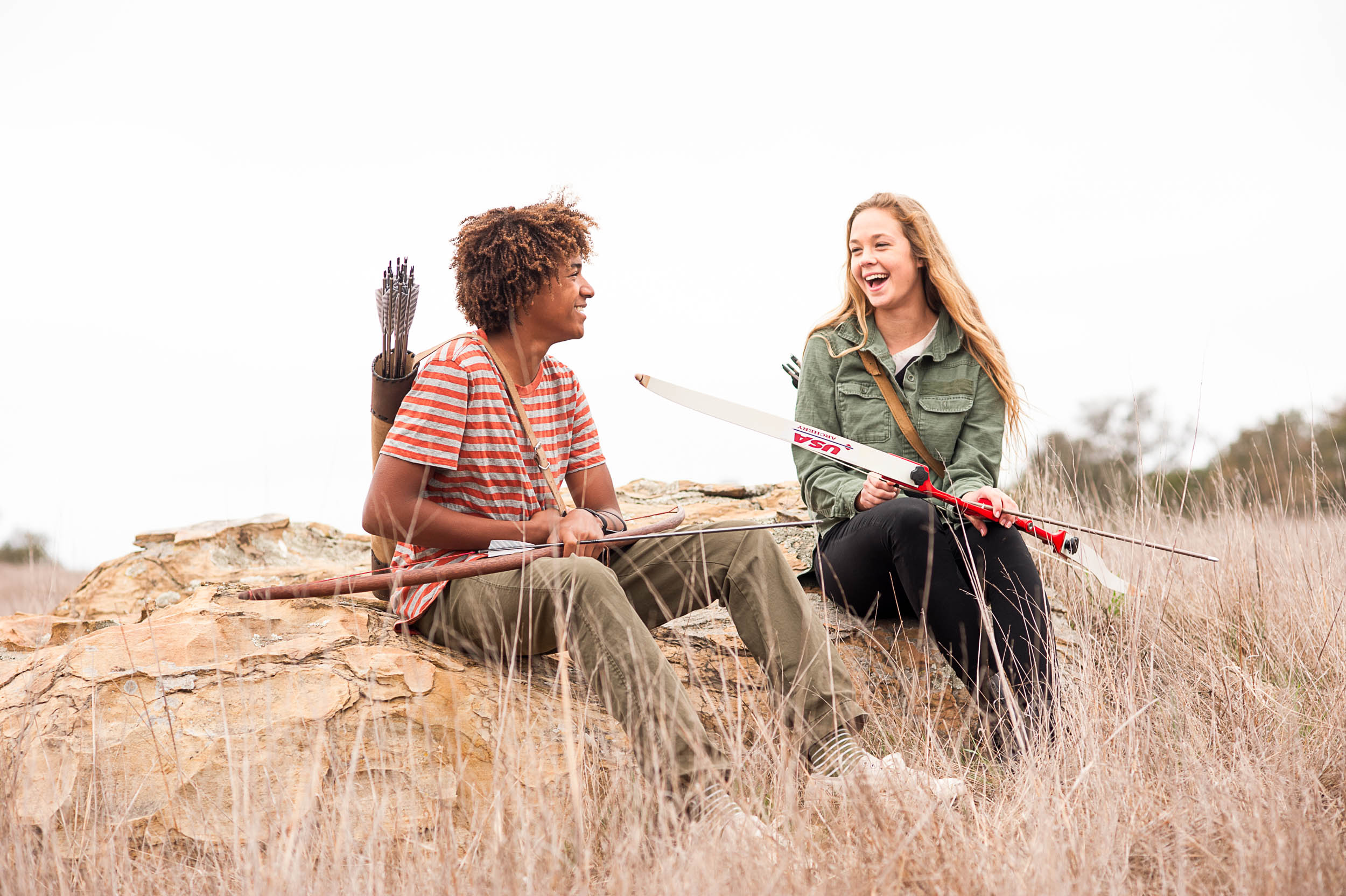 Two teenagers laugh outdoors for archery ad campaign in Malibu, Calif.