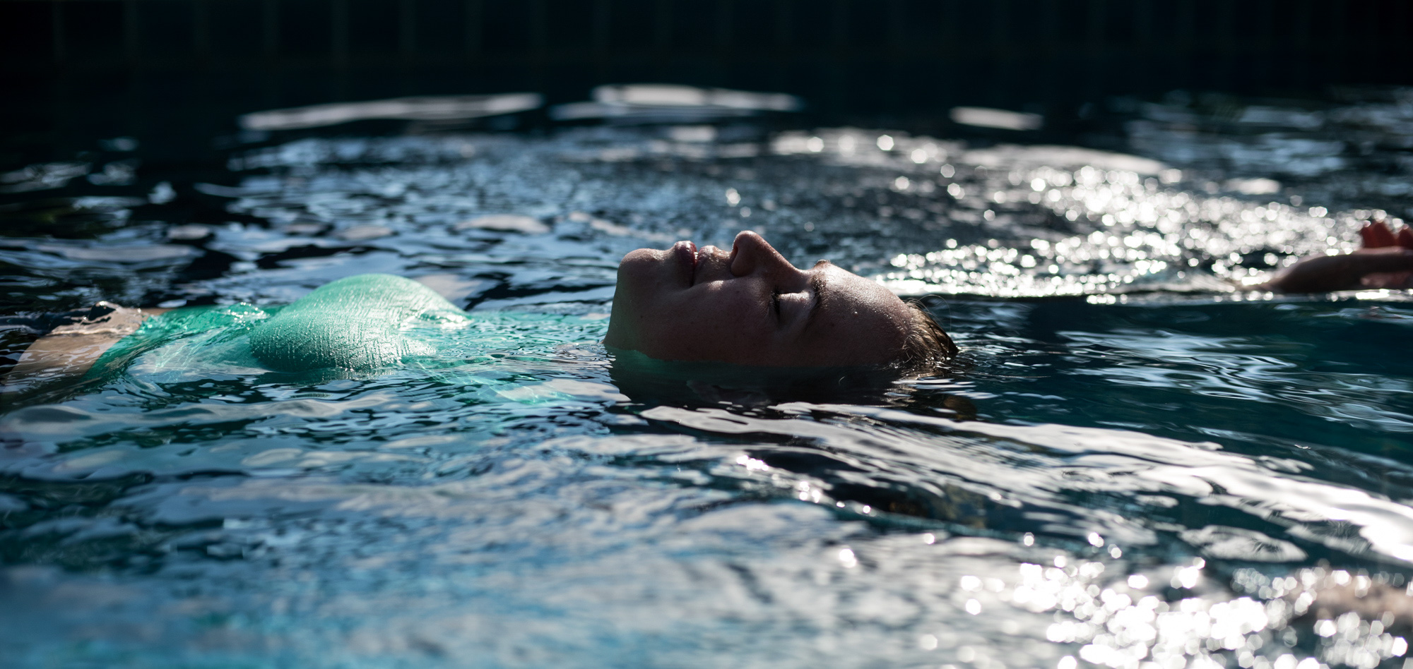 A woman reclines in the pool at a resort in Thailand.