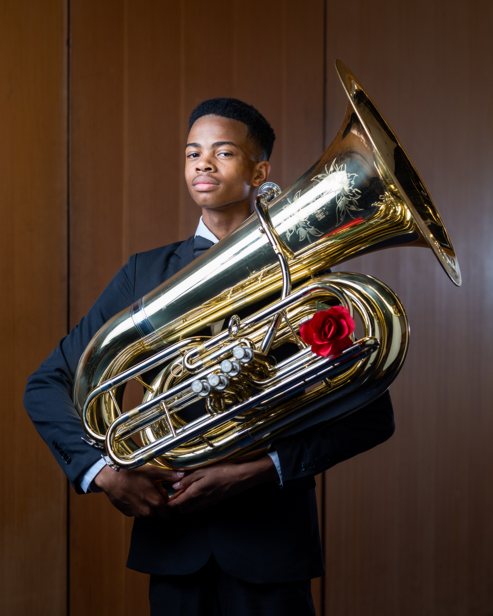 A young tuba player poses for a portrait in Los Angeles.