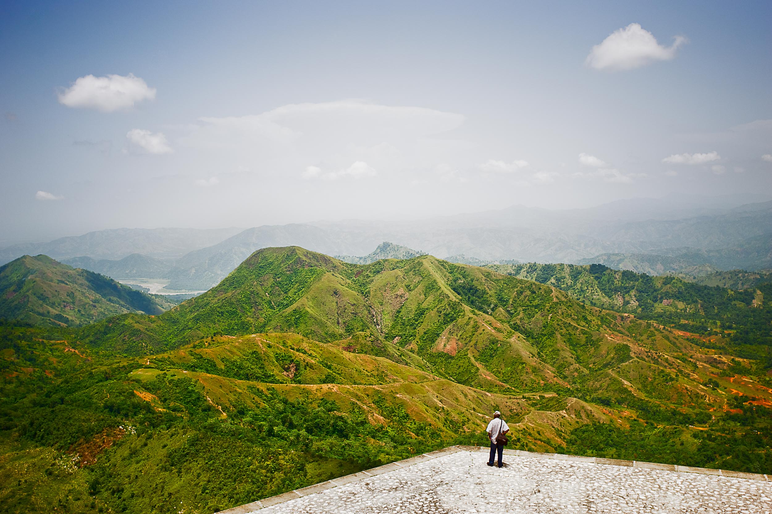 A man looks at mountains from the Citadel in Milot, Haiti.
