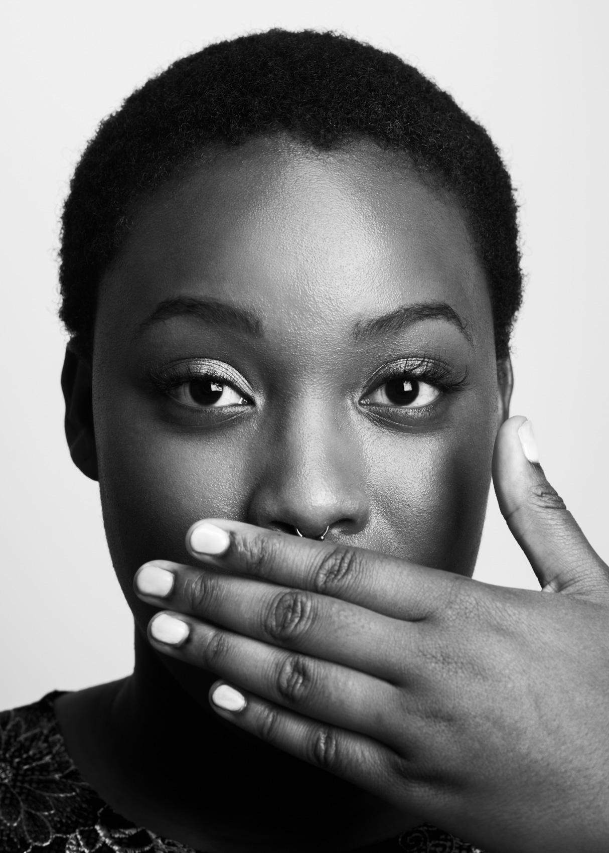 Studio portrait of female musician hand covering mouth in Venice, Calif.