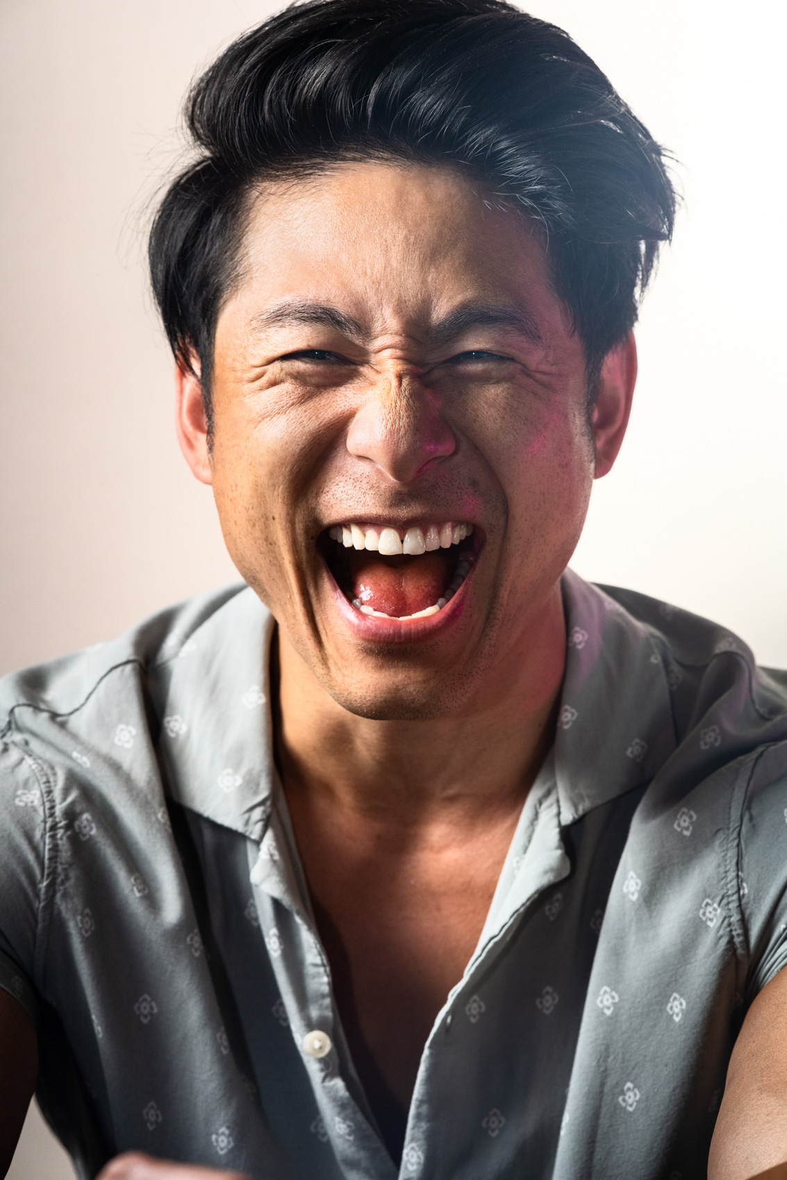 Laughing actor portrait in a studio in Los Angeles.