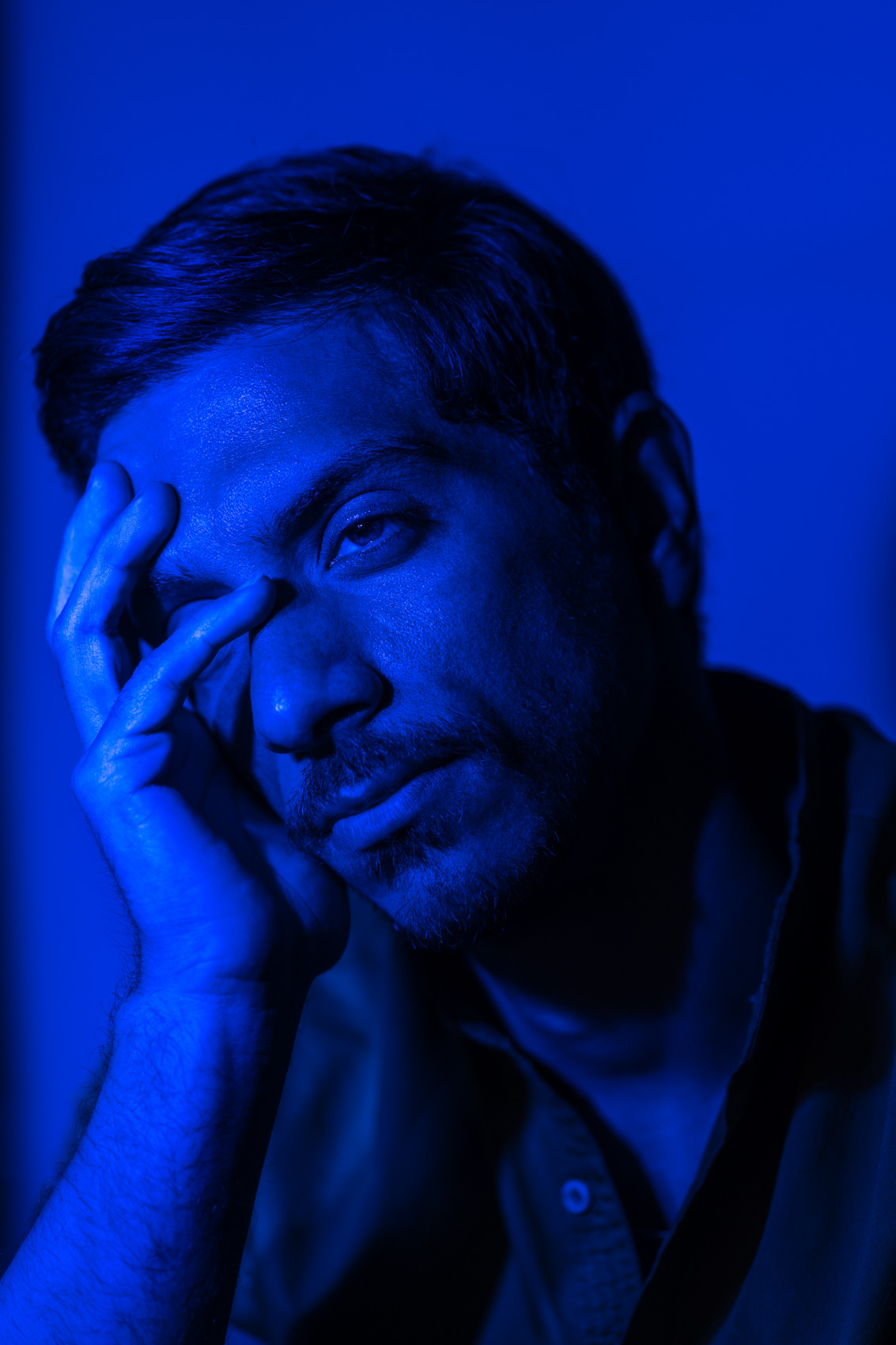 Portrait of an actor in blue light in Los Angeles, Calif.