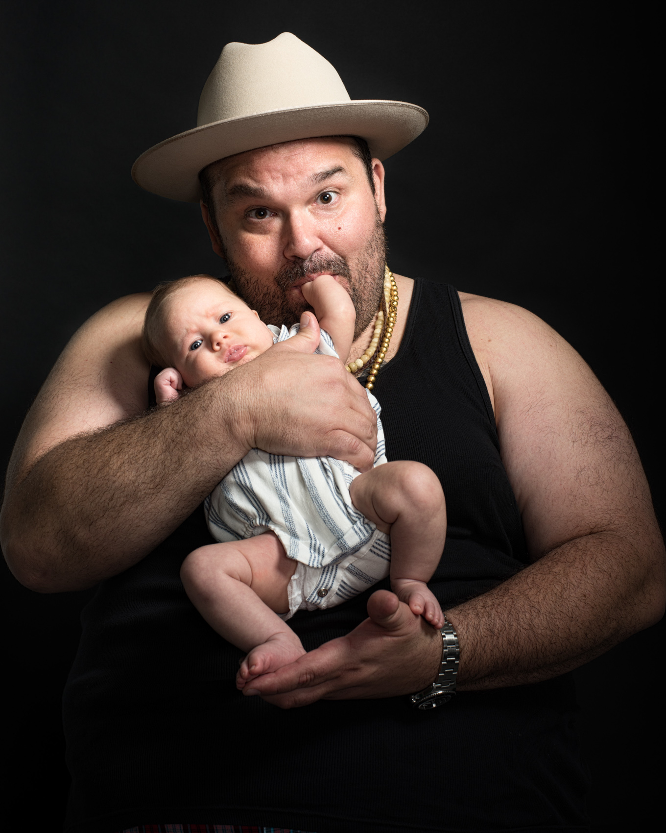 Studio portrait of actor Melvin Rodriguez with his daughter in Venice, Los Angeles.